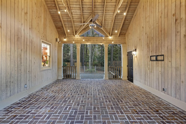 interior space with lofted ceiling with beams and wood ceiling