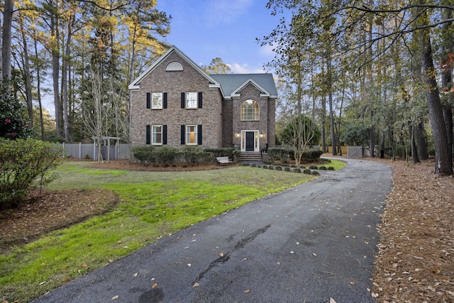 view of property with a front lawn