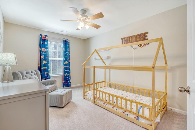 bedroom with visible vents, baseboards, ceiling fan, and carpet flooring