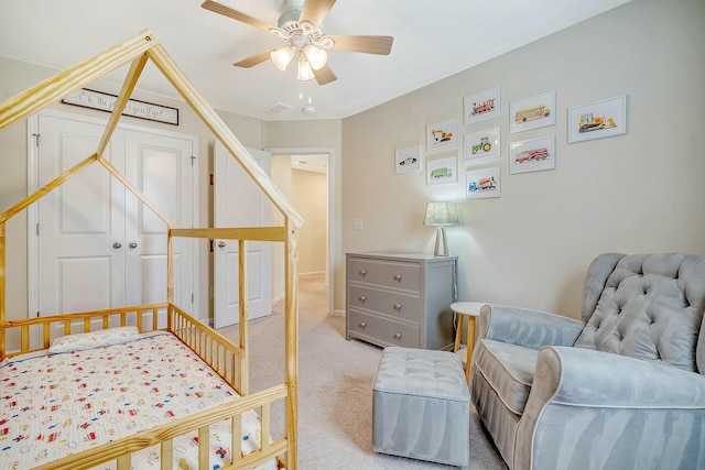 carpeted bedroom featuring a ceiling fan