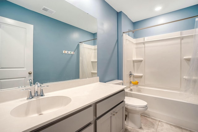 bathroom with visible vents, toilet, vanity, and shower / tub combo