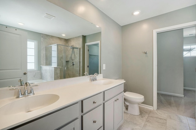 full bath with a sink, visible vents, baseboards, and a stall shower