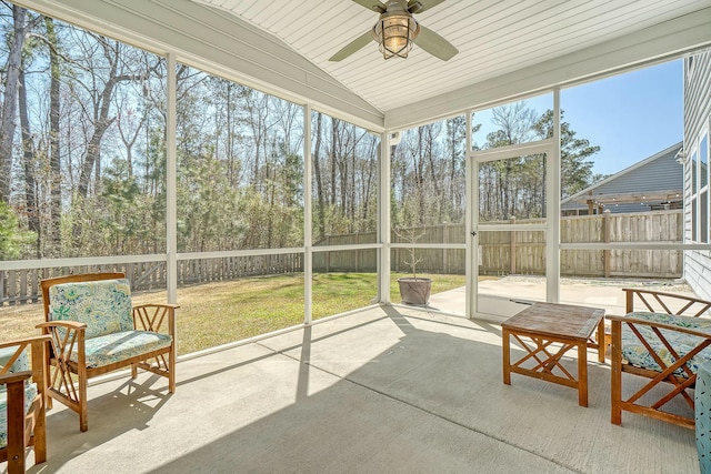 sunroom / solarium featuring vaulted ceiling and ceiling fan