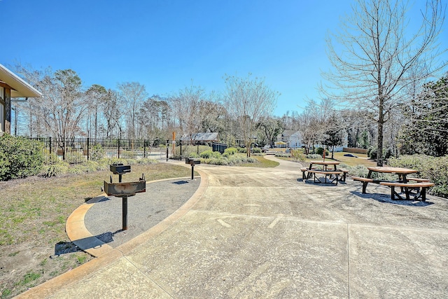 view of community featuring fence