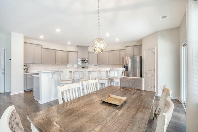 dining area featuring recessed lighting, visible vents, dark wood-style flooring, and baseboards