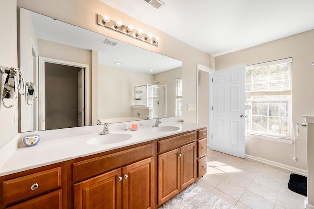 full bathroom with a shower stall, visible vents, and a sink