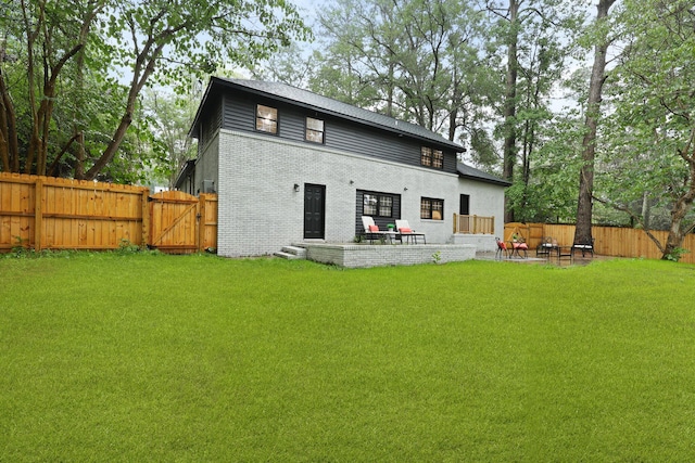 120 Live Oak Rd, Summerville, SC 29485 - back of house featuring a gate, a patio area, a fenced backyard, a yard, and brick siding