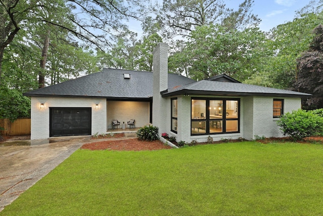 120 Live Oak Rd, Summerville, SC 29485 - back of property with brick siding, driveway, a chimney, and a garage