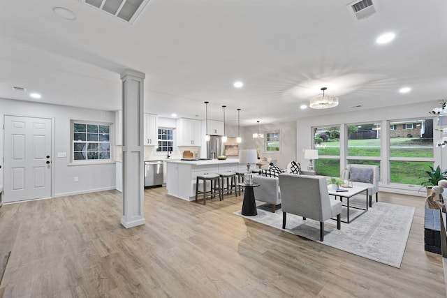 120 Live Oak Rd, Summerville, SC 29485 - living room featuring recessed lighting, visible vents, and decorative columns
