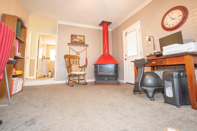 office featuring crown molding, brick wall, carpet floors, and a wood stove