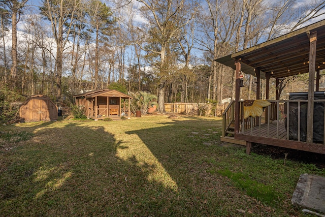 view of yard featuring a deck and a shed