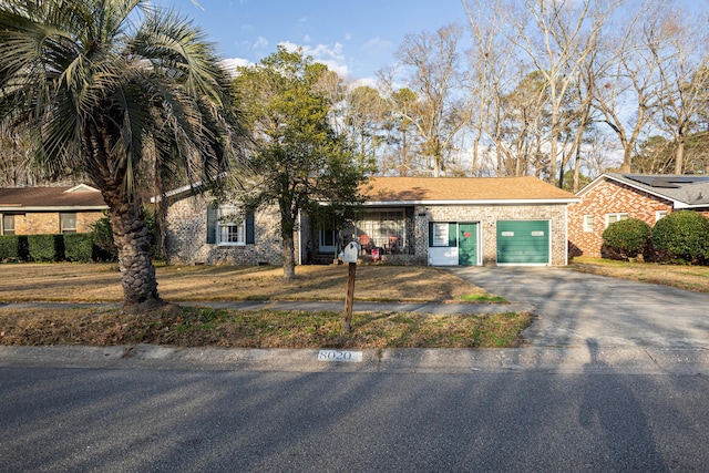 single story home featuring a garage