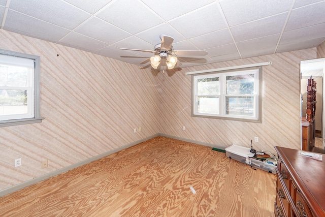 unfurnished room with a paneled ceiling and ceiling fan