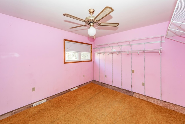 interior space with ceiling fan