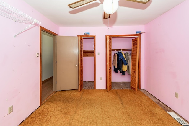 unfurnished bedroom featuring ceiling fan and light colored carpet