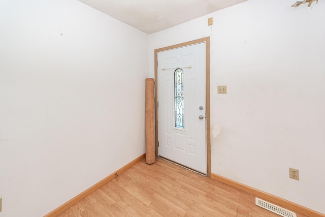 foyer with light hardwood / wood-style flooring