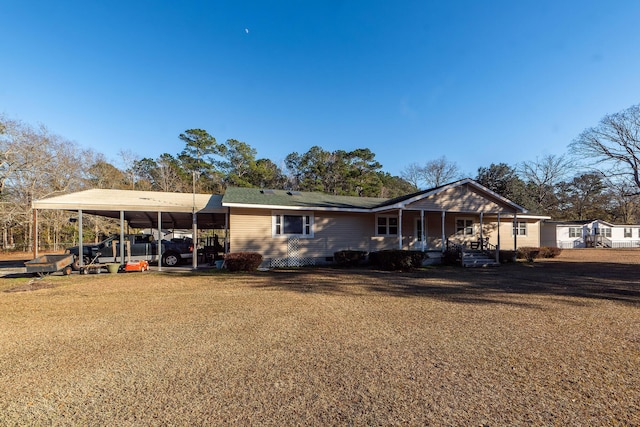 view of front of house featuring a carport and covered porch