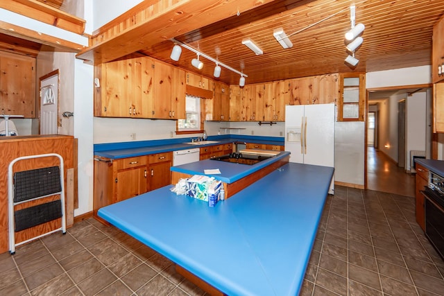 kitchen featuring sink, wooden ceiling, track lighting, and white appliances