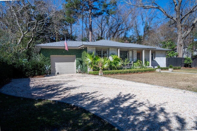 ranch-style home featuring a garage, concrete driveway, and brick siding