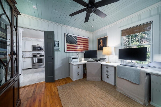 home office featuring light wood-type flooring, wood ceiling, and crown molding