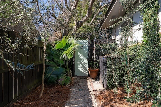 view of yard featuring a gate and fence