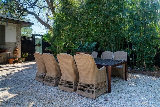 view of patio / terrace featuring outdoor dining space and fence