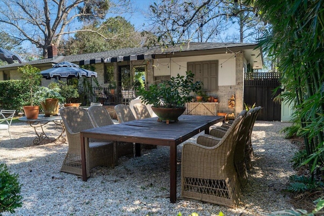 view of patio / terrace featuring fence