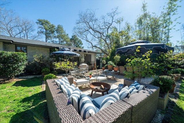 view of patio / terrace featuring an outdoor fire pit