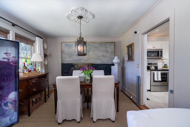 dining space with light colored carpet