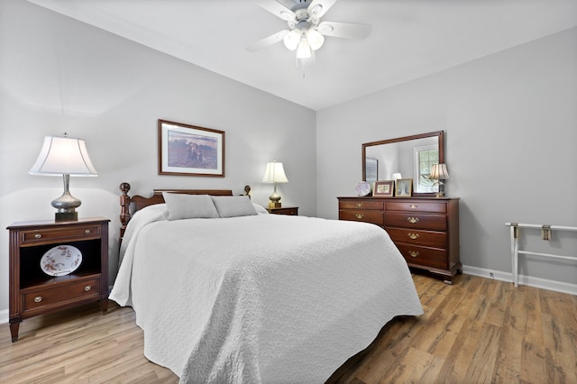 bedroom with light wood-style flooring, baseboards, and ceiling fan
