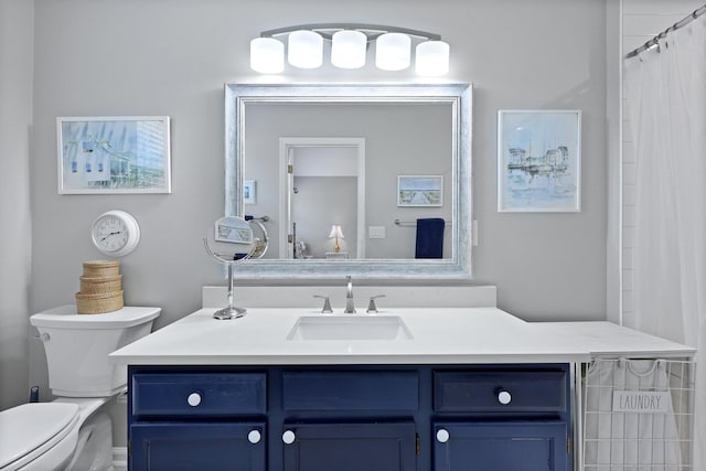 bathroom with vanity and toilet