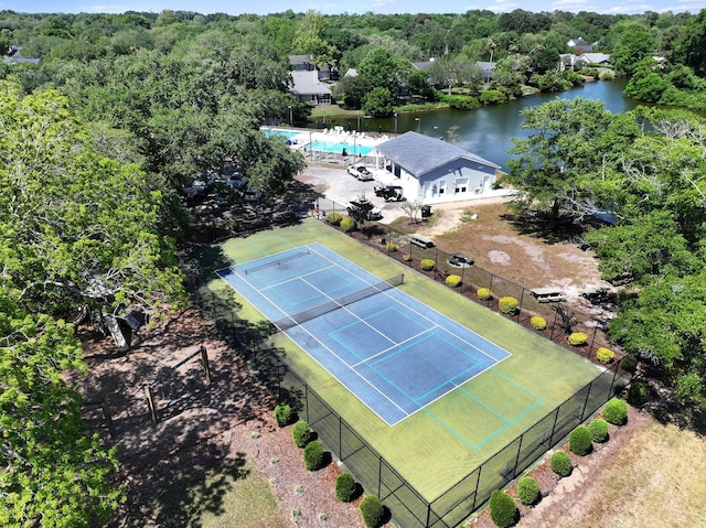 bird's eye view of a pool area and a large body of water