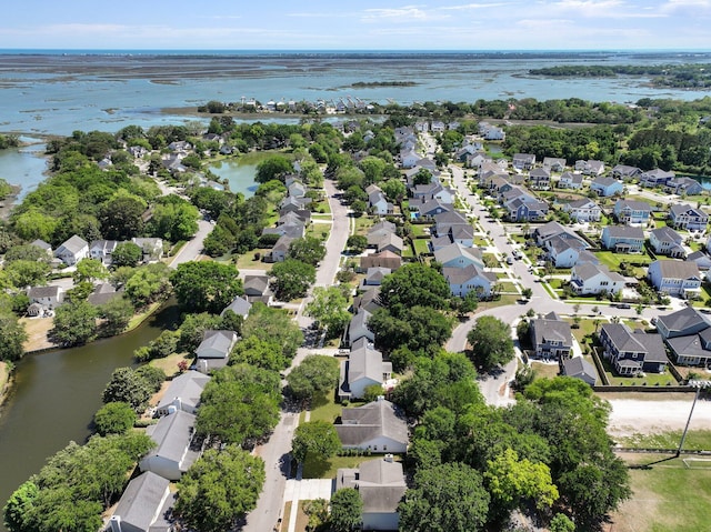 aerial perspective of suburban area with a large body of water