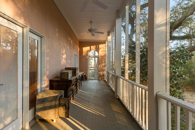 sunroom featuring ceiling fan and lofted ceiling