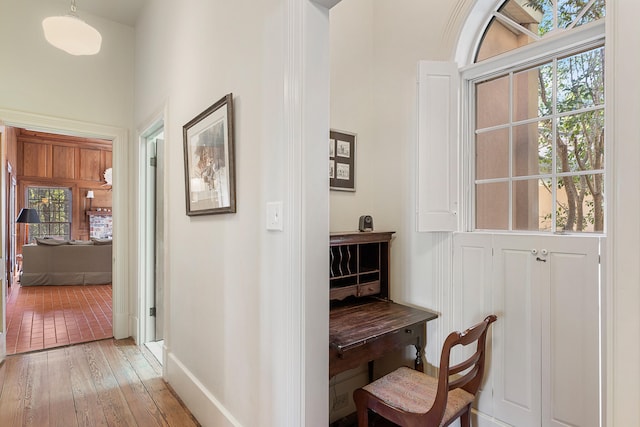 hall with light hardwood / wood-style floors