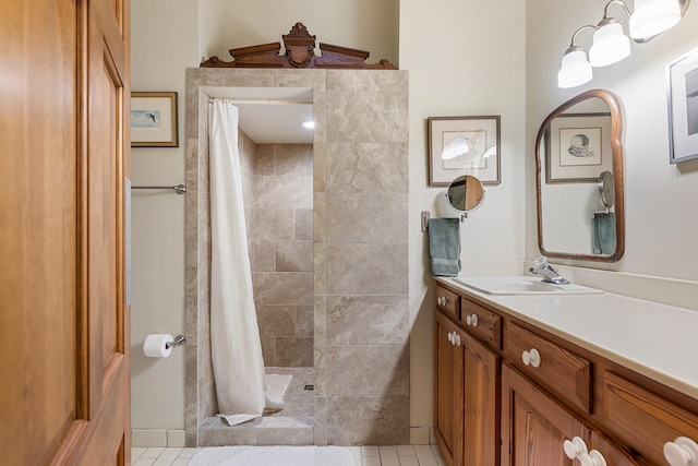 bathroom featuring a shower with shower curtain, tile flooring, and vanity