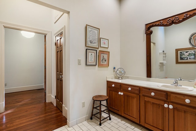 bathroom featuring tile floors and vanity