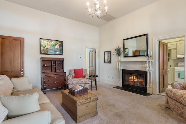 living room featuring a chandelier and light colored carpet