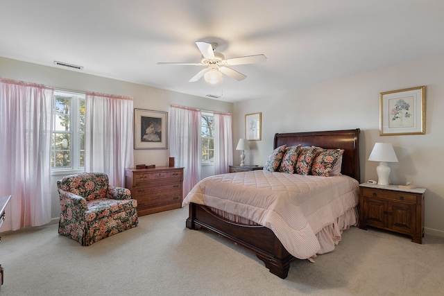 bedroom featuring ceiling fan and light carpet