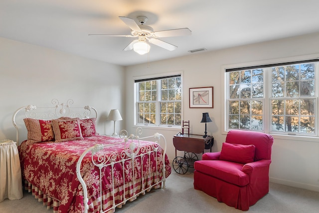 bedroom with light carpet and ceiling fan