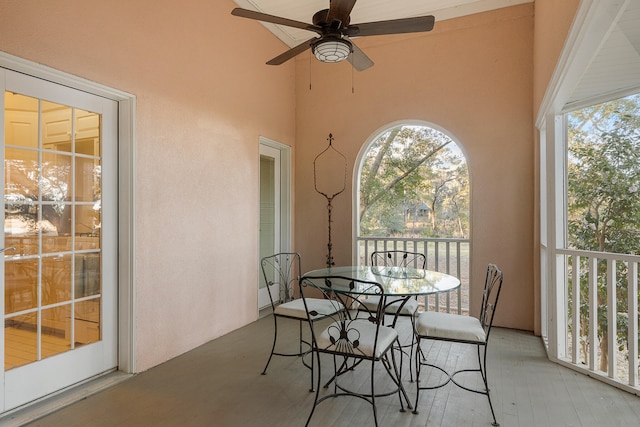 sunroom with ceiling fan and a healthy amount of sunlight