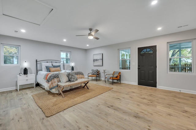 bedroom with ceiling fan and light wood-type flooring