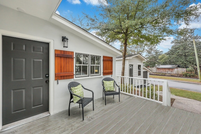 deck with an outbuilding