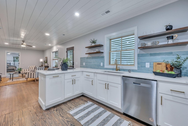 kitchen with sink, dishwasher, hardwood / wood-style floors, white cabinets, and wooden ceiling