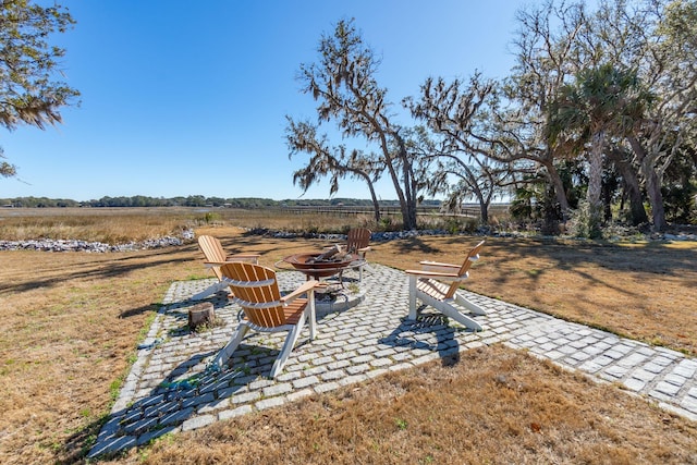 view of yard with a fire pit