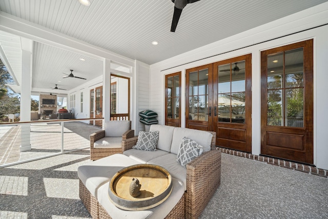 view of patio / terrace featuring an outdoor living space, ceiling fan, and french doors