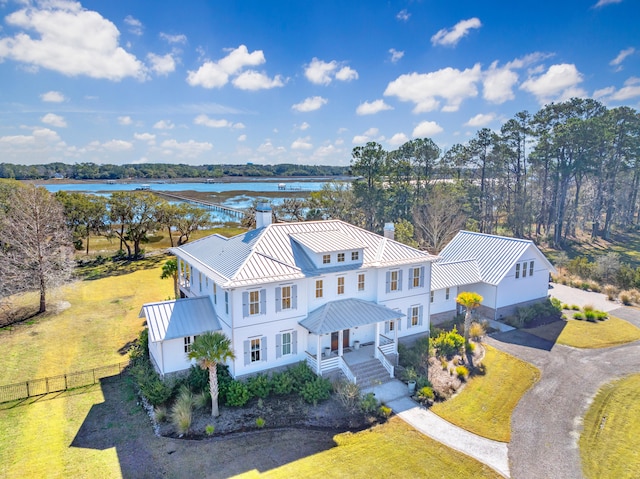 birds eye view of property featuring a water view