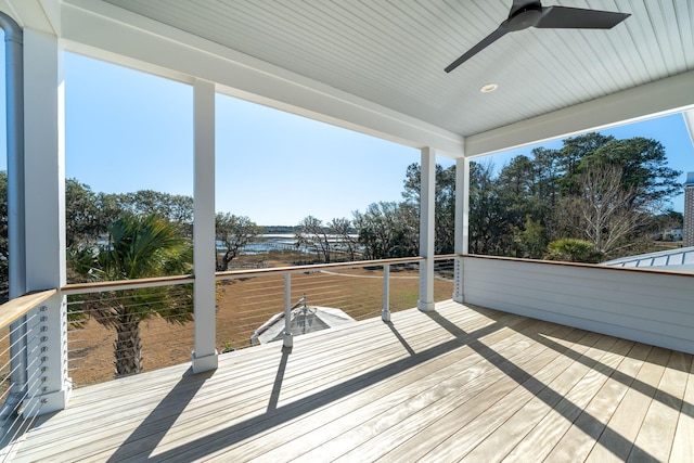 wooden deck featuring ceiling fan