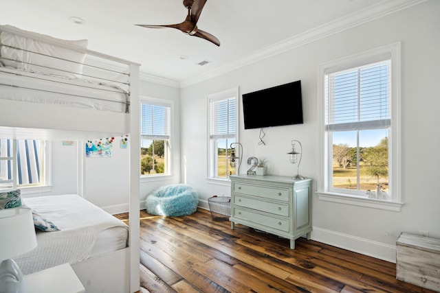 bedroom with ceiling fan, crown molding, and dark hardwood / wood-style floors