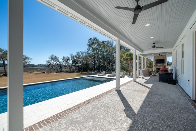 view of swimming pool with an outdoor hangout area, a patio area, and ceiling fan